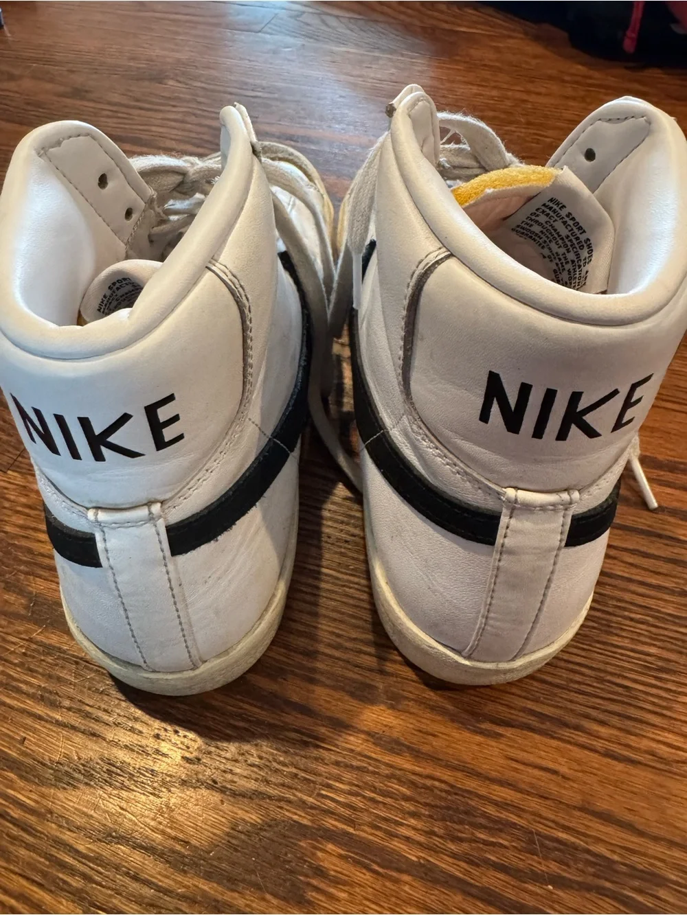 Nike Blazer White High-Top Sneakers with Black Swoosh Woman 11